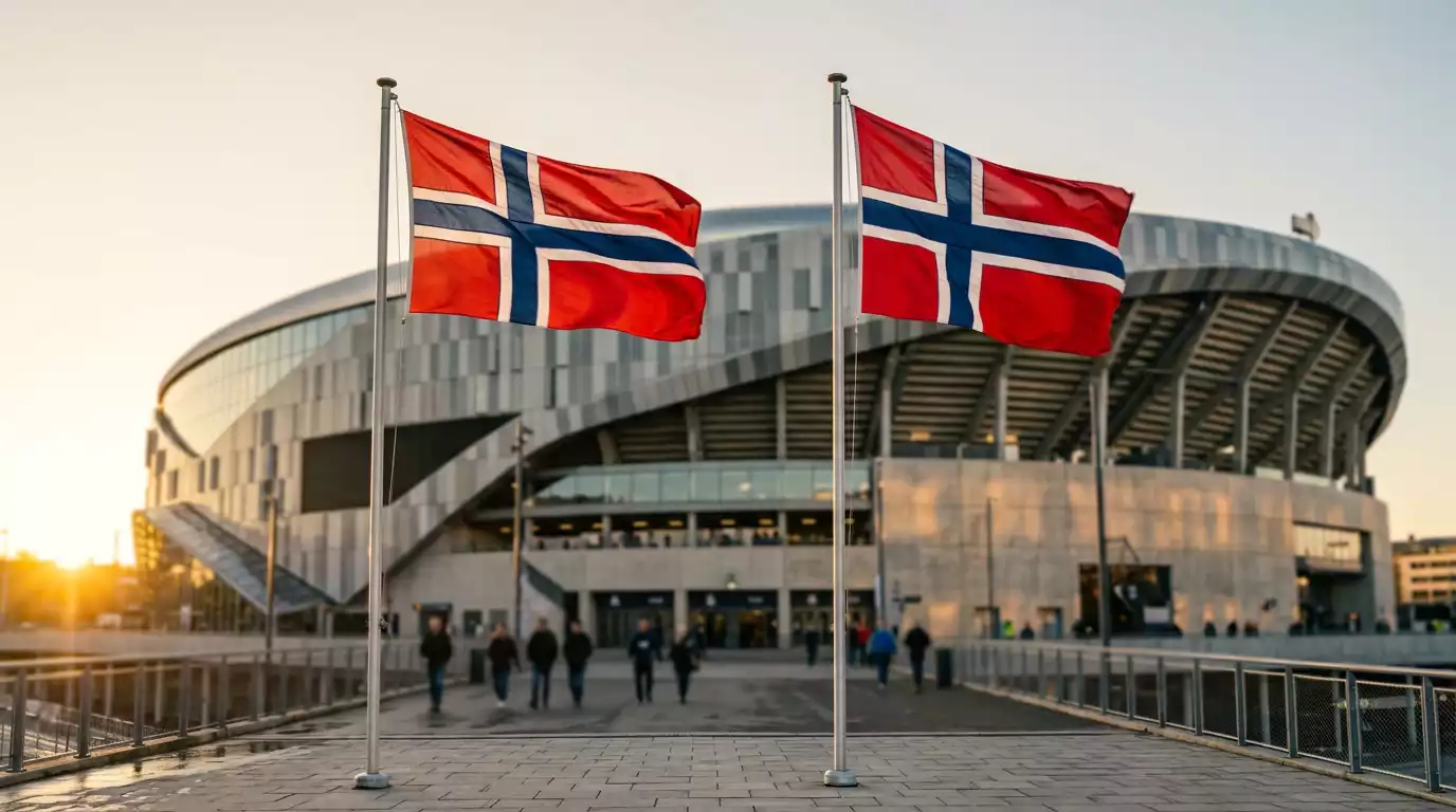 Norrænir fánar blakta fyrir framan stóran knattspyrnuvöll